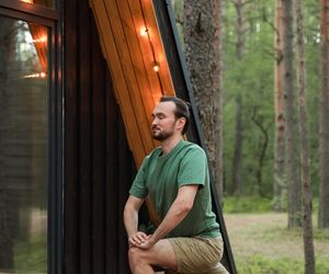 A person in a fluid yoga transition pose.